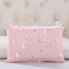 A pink cartoon pillowcase featuring various stars, clouds, and yellow crescent moons for kids.