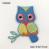 A blue owl embroidered patch with pink and yellow accents for DIY customization.