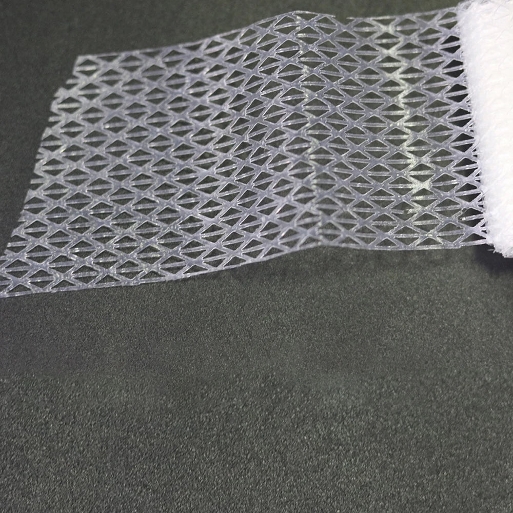 Ruban de ourlet à fixer à la fer, maille transparente avec fond blanc