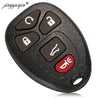 A black replacement car key fob with various buttons and a red key blank is shown.