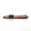 A brown leather tape measure holder with a metal belt clip resting on a white surface.