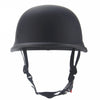 Matte black vintage German half-face motorcycle helmet with a padded visor and adjustable strap.