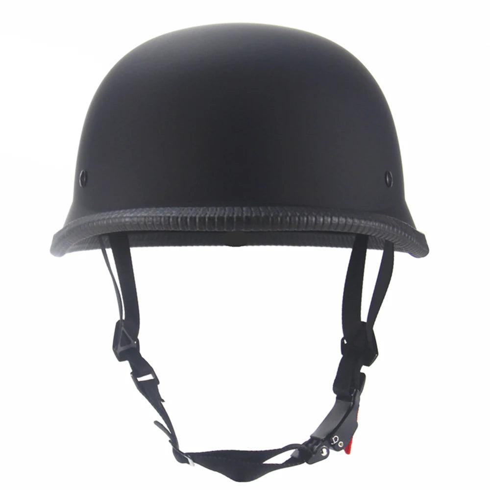 Matte black vintage German half-face motorcycle helmet with a padded visor and adjustable strap.