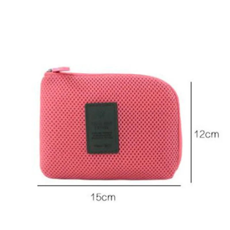 A pink compact travel cable organizer bag shown from the top, with dimensions of 12cm by 15cm.