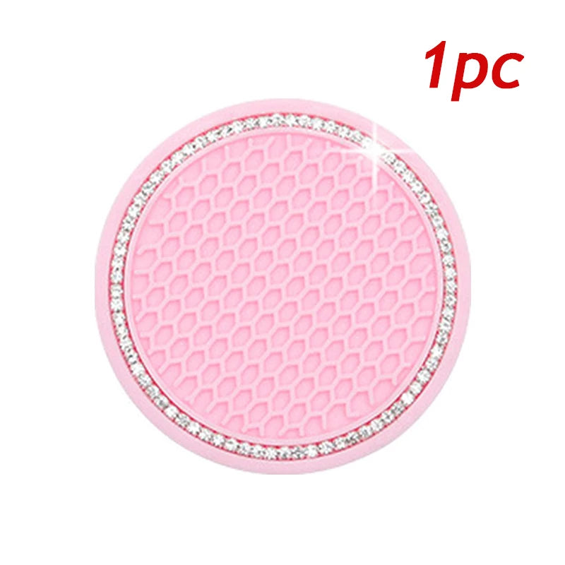 Pink crystal rhinestone non-slip cup mat for cars, circular silicone product.