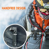 A person wearing outdoor gear is using a handfree LED flashlight attached to their vest.