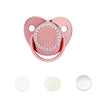 A pink sparkling rhinestone pacifier with a clip designed for babies.