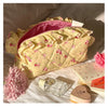 Neceser acolchado con estampado floral y lazo decorativo