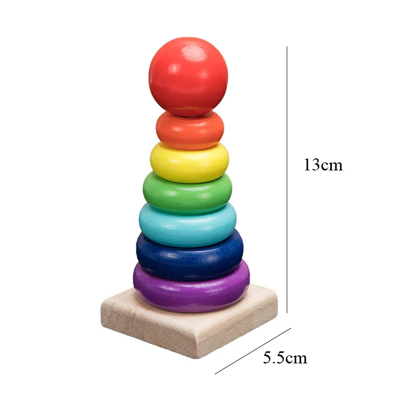 A stack of colorful wooden rings in rainbow order, used as a Montessori 3D puzzle for toddlers.