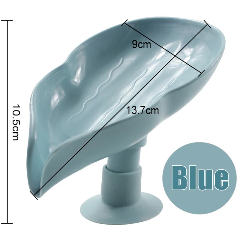 A light blue leaf-shaped suction cup soap dish with a self-draining tray and a stand.