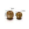 Two natural wooden spacer beads shown with dimensions, measuring 11mm high and 10mm diameter.
