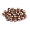 A pile of round, bronze-colored imitation pearl beads for jewelry making.