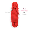 A red cotton rope with a metal cover, 20 meters long, used for Shibari bondage.