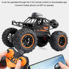 A black 1:18 RC off-road SUV is shown with a mobile phone controlling it via a 2.4G remote or downloaded app.