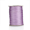 Spool of purple waxed cotton cord used for jewelry making