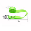 A roll of bright lime green heavy-duty tie-down straps with metal buckles, showing the length and width.