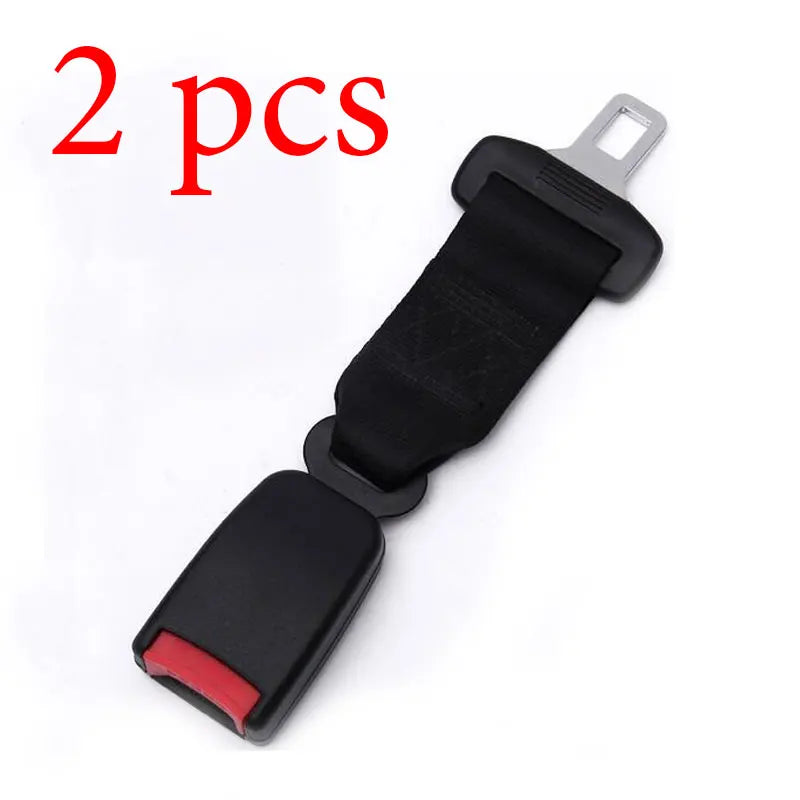 Two black seat belt extenders with metal buckles shown against a white background.