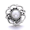 Silver metal snap button with a round pearl centerpiece for jewelry making