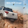 A white Ford Toro SUV driving through a dusty trail, shown in dark, with WDR image, and bright conditions.
