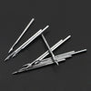 A multi-pack of sharp silver sewing machine needles laid diagonally on a dark surface.