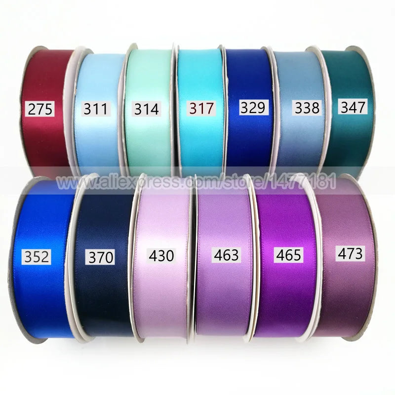 A collection of colorful satin ribbons in various shades including red, blue, green, and purple.