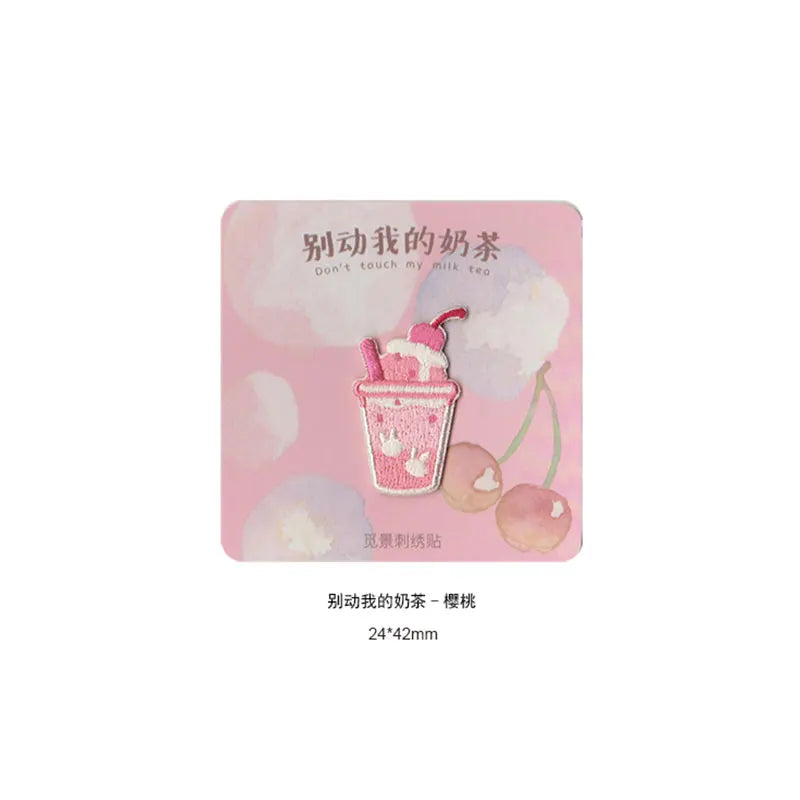 Pink embroidered iron-on patch featuring a pink ice cream cone design.