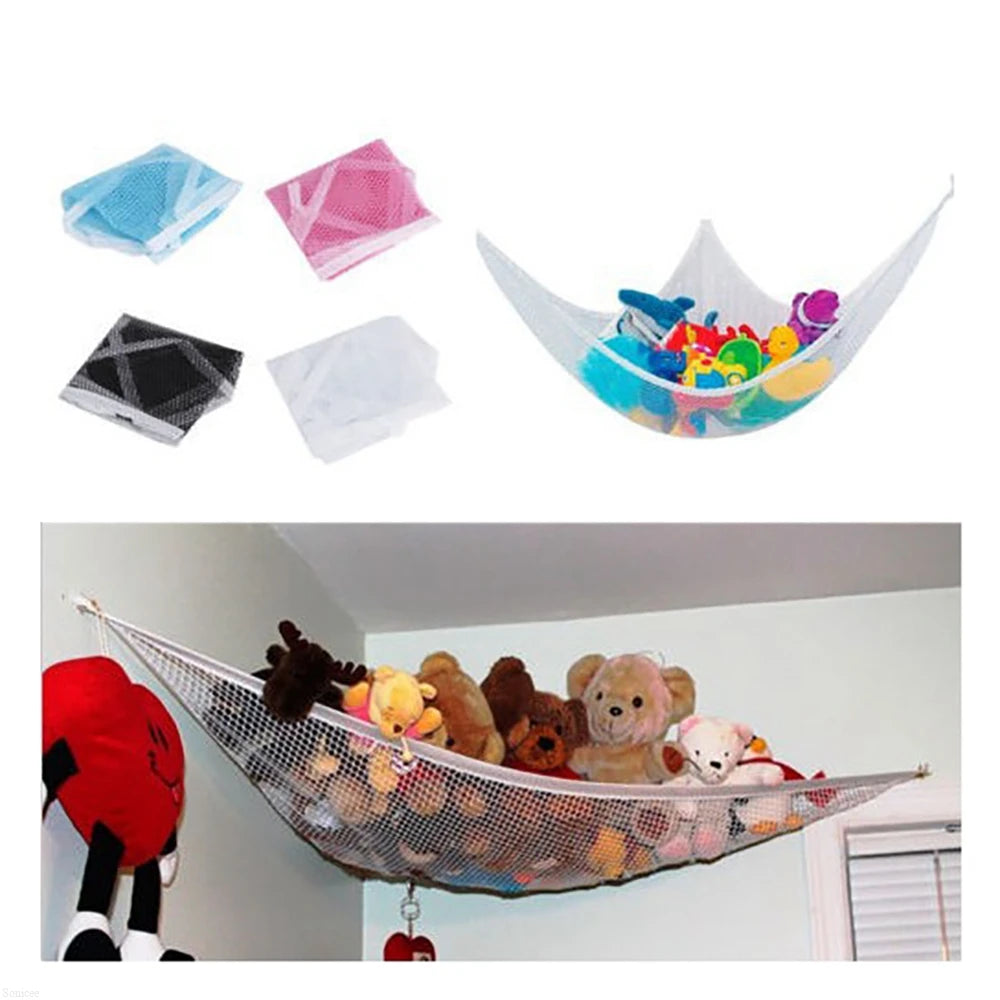 A colorful kids toy storage hammock suspended in a room, featuring various toys and netting.