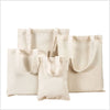 A collection of light beige canvas tote bags displayed against a white background.