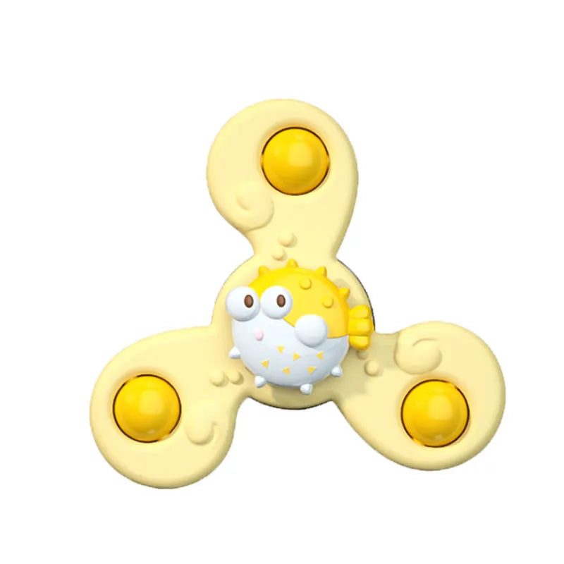 A yellow suction cup spinner bath toy for toddlers with a cute face design.