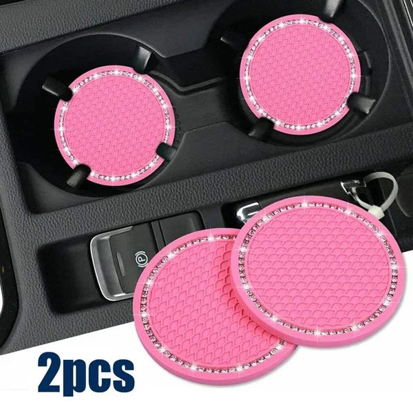 Two pink rhinestone non-slip cup mats for cars are shown in a black organizer tray.