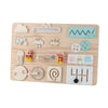 A wooden Montessori busy board featuring various puzzles, tools, and manipulative parts for fine motor skill development.