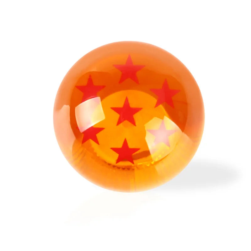 A glossy orange spherical shift knob featuring a star design.