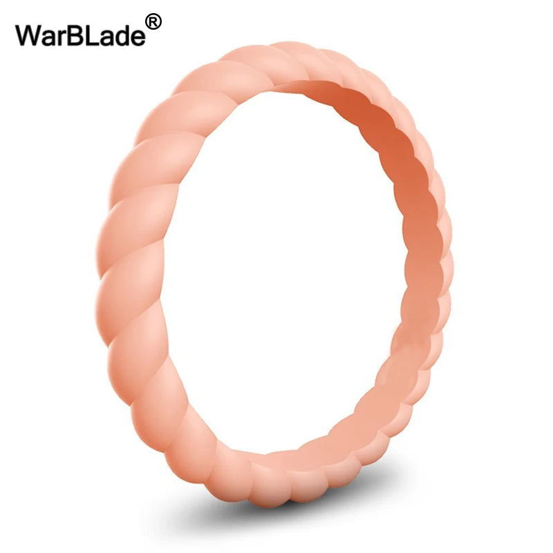 A close-up view of a braided silicone ring in a soft peach or nude color.