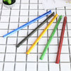 A collection of colored aluminium triangular scale rulers laid out on a white grid background.