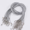 A bundle of silver gray adjustable leather cord necklaces with metal clasps