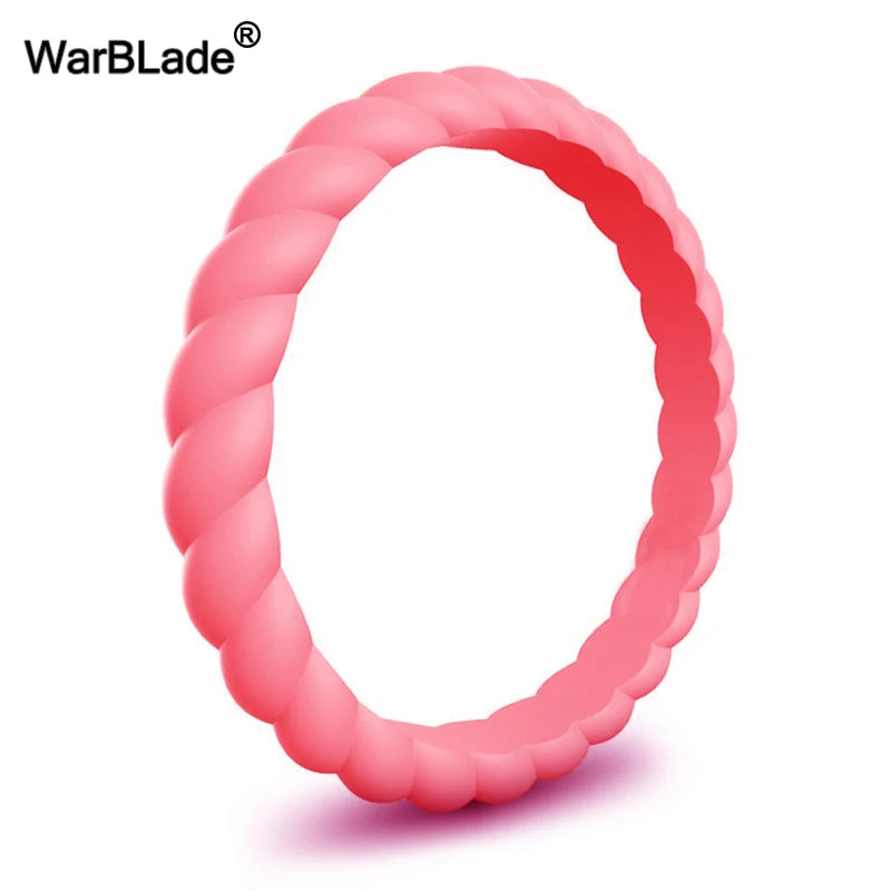 A pink braided silicone ring shown in a close-up view.
