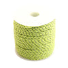 A coil of bright yellow high-visibility reflective paracord for camping and DIY projects.