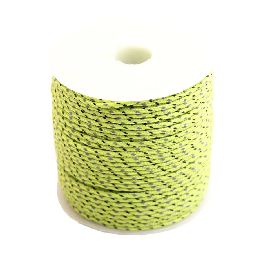 A coil of bright yellow high-visibility reflective paracord for camping and DIY projects.