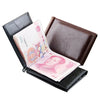 A black leather wallet is open, displaying a pink banknote and showing the magnetic closure mechanism.