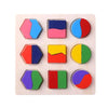 A wooden puzzle board with various geometric shapes and colors including triangles, squares, and circles.