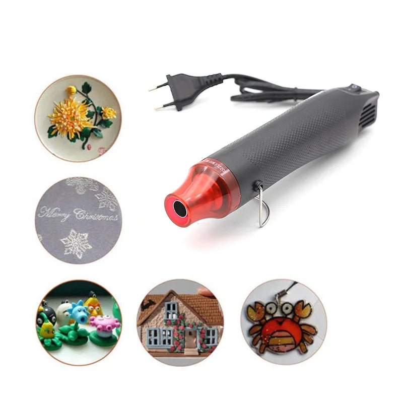 A black heat gun is shown with various decorative Christmas-themed tips and accessories.