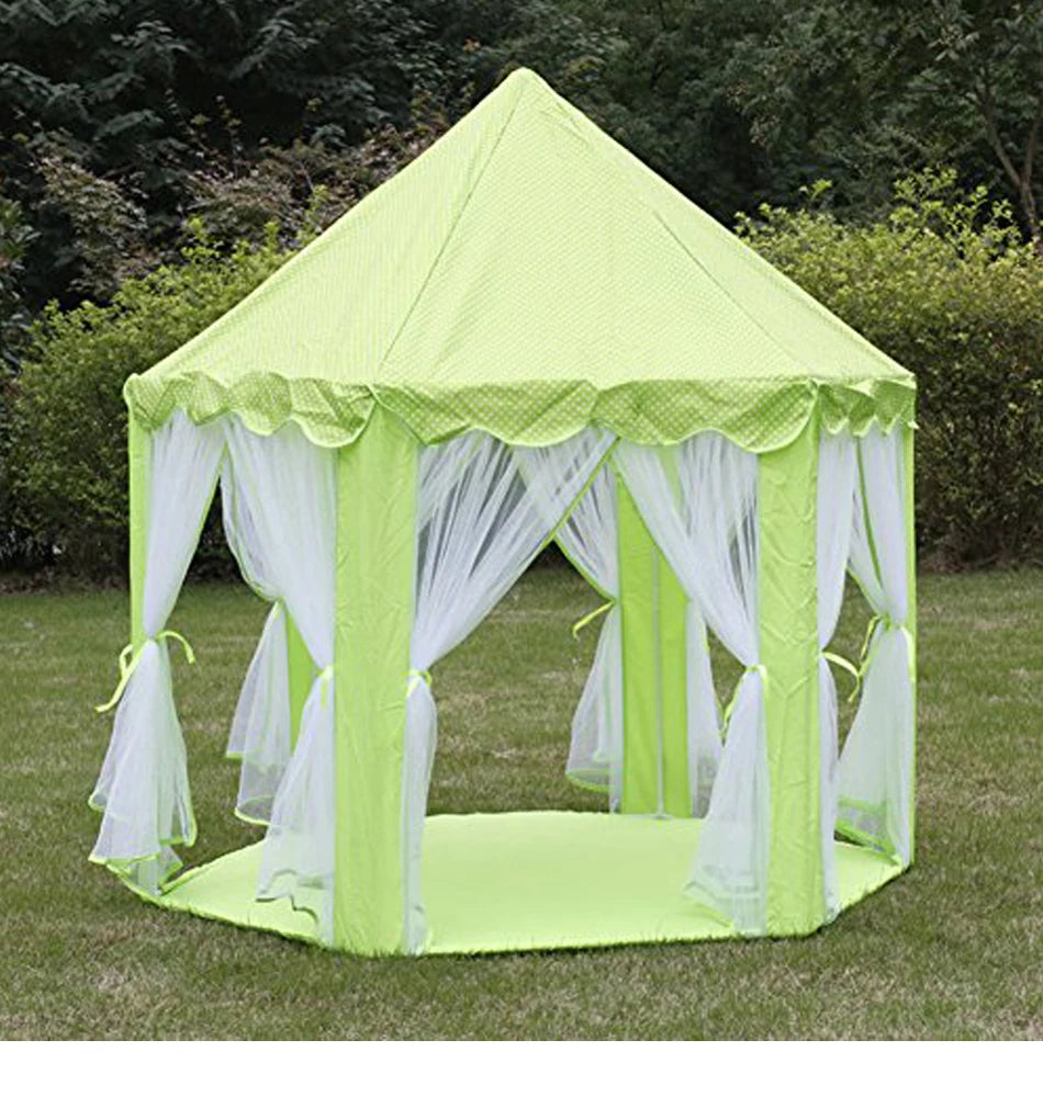 A lime green foldable princess tipi play tent with sheer white draping set up outdoors on grass.
