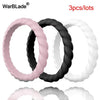 Three lots of braided silicone rings in pink, black, and white.