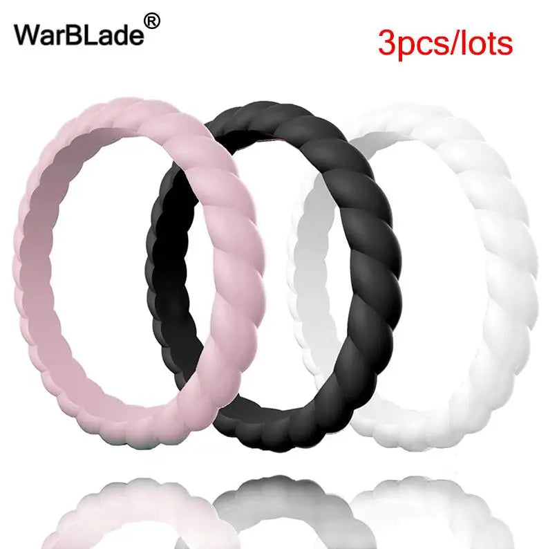 Three lots of braided silicone rings in pink, black, and white.
