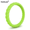 A bright lime green braided silicone ring shown against a white background.
