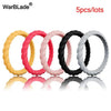 Five assorted colored braided silicone rings displayed in a row.