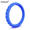 A close-up view of a bright blue braided silicone ring.