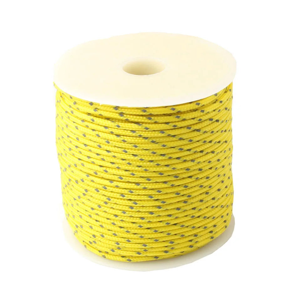 A spool of yellow high-visibility reflective paracord coiled on a white background.