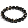 A stretch bracelet made of natural black gold obsidian gemstones.