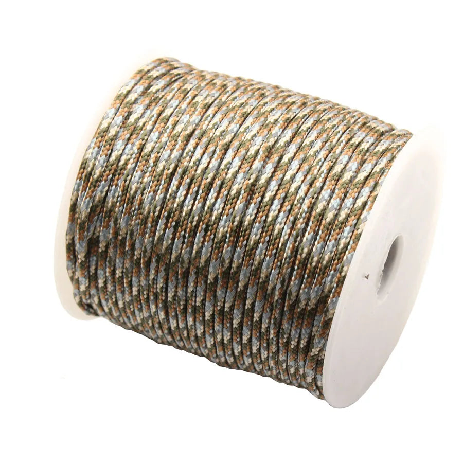 Roll of brown and gray high-visibility reflective paracord rope for camping and DIY projects